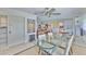 Open dining area featuring a glass table, modern decor, and lots of natural light at 1811 Milford Cir, Sun City Center, FL 33573