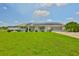 Charming single-story home with well-manicured lawn and solar panels at 1811 Milford Cir, Sun City Center, FL 33573
