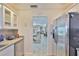 Kitchen with stainless refrigerator and view to living space at 1811 Milford Cir, Sun City Center, FL 33573