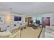 Cozy living room with comfortable seating and built-in shelving unit at 1811 Milford Cir, Sun City Center, FL 33573
