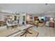 Open living area with tile floors, ceiling fan, neutral colors, and multiple seating areas at 1811 Milford Cir, Sun City Center, FL 33573