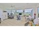 Spacious home office featuring multiple workstations and serene views of the water at 1811 Milford Cir, Sun City Center, FL 33573
