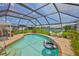 Screened-in pool with outdoor seating and serene water views at 1811 Milford Cir, Sun City Center, FL 33573
