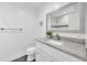 Bathroom featuring a granite vanity and a modern framed mirror at 2106 Sherbrook Dr, Valrico, FL 33594