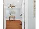 Inviting bedroom featuring hardwood floors, a ceiling fan, and a sunny window offering a cozy and relaxing atmosphere at 2106 Sherbrook Dr, Valrico, FL 33594