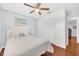 Cozy bedroom with a ceiling fan and closet, offering a relaxing space at 2106 Sherbrook Dr, Valrico, FL 33594