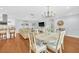 Stylish dining room with hardwood floors, elegant decor, and seamless transition to the modern kitchen at 2106 Sherbrook Dr, Valrico, FL 33594