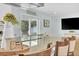 Bright kitchen featuring granite countertops, island with seating, and modern appliances, perfect for culinary enthusiasts at 2106 Sherbrook Dr, Valrico, FL 33594
