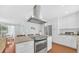 Beautiful kitchen island with modern appliances, ample countertop space, and a seamless connection to the dining area at 2106 Sherbrook Dr, Valrico, FL 33594