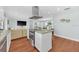 Spacious kitchen with granite countertops, stainless steel appliances, and a functional center island and open floor plan at 2106 Sherbrook Dr, Valrico, FL 33594