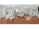 Open-concept living room featuring hardwood floors, stylish furnishings, and an abundance of natural light at 2106 Sherbrook Dr, Valrico, FL 33594