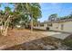 Private backyard featuring a concrete patio and ample green space, creating a serene outdoor retreat at 2145 68 S Ave, St Petersburg, FL 33712