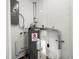 Basement featuring a water heater, plumbing, and other utilities at 2145 68 S Ave, St Petersburg, FL 33712