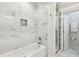 Elegant bathroom showcasing marble tile, modern fixtures, and a shower with glass door at 2405 W North B St # 1, Tampa, FL 33609