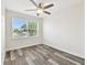 Bright bedroom featuring vinyl flooring and a large window providing lots of natural light at 2405 W North B St # 1, Tampa, FL 33609