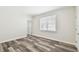 A large bedroom featuring vinyl flooring and a large window providing lots of natural light at 2405 W North B St # 1, Tampa, FL 33609