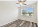 Bright bedroom featuring vinyl flooring and a large window providing lots of natural light at 2405 W North B St # 1, Tampa, FL 33609