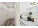 Walk-in closet and Primary bedroom suite with ample shelving, natural light, and inviting decor at 2405 W North B St # 1, Tampa, FL 33609