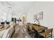 Open-concept dining area with modern table, chairs, and seamless flow to the kitchen at 2405 W North B St # 1, Tampa, FL 33609