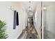 Inviting foyer with wood-look flooring, modern light fixtures, and a convenient coat rack at 2405 W North B St # 1, Tampa, FL 33609
