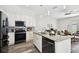 Modern kitchen with stainless steel appliances, granite counters, and an open concept design at 2405 W North B St # 1, Tampa, FL 33609