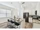 Modern kitchen with an island bar, stainless steel appliances, and bright natural light at 2405 W North B St # 1, Tampa, FL 33609