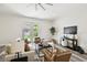Well-lit living room boasts an open floor plan and French doors leading to the outdoor space at 2405 W North B St # 1, Tampa, FL 33609