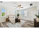 Serene primary bedroom with natural light, neutral decor, ceiling fan, and ample space at 2405 W North B St # 1, Tampa, FL 33609