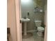 Powder room with a pedestal sink, a tile floor, and a toilet at 2588 Bartolo Dr, Land O Lakes, FL 34639