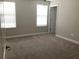 Neutral bedroom with carpet, a ceiling fan, natural light, and a closet at 2588 Bartolo Dr, Land O Lakes, FL 34639