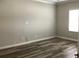 Bedroom with a window and wood-look flooring at 2588 Bartolo Dr, Land O Lakes, FL 34639