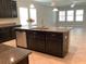 A spacious kitchen area featuring an island with sink and stainless steel dishwasher at 2588 Bartolo Dr, Land O Lakes, FL 34639