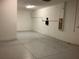Large unfinished storage room with white walls, a concrete floor and electrical panel at 2588 Bartolo Dr, Land O Lakes, FL 34639