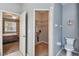 Bathroom with an open door to bedroom and to closet provides convenient access at 27810 Sky Lake Cir, Wesley Chapel, FL 33544