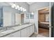 Bathroom showcases granite countertops, double sinks, and an open doorway at 27810 Sky Lake Cir, Wesley Chapel, FL 33544