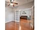 Bedroom features french doors leading to a living room with ample space at 27810 Sky Lake Cir, Wesley Chapel, FL 33544