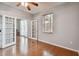 Bedroom with hardwood floors and french doors leading to another room offers flexibility at 27810 Sky Lake Cir, Wesley Chapel, FL 33544