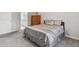 Bedroom features a plush bed, dresser, and neutral tones creates a serene environment at 27810 Sky Lake Cir, Wesley Chapel, FL 33544