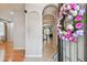 Entryway with a decorative wreath on the front door, archways, and views of the interior at 27810 Sky Lake Cir, Wesley Chapel, FL 33544
