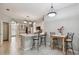 Kitchen with counter seating, and adjacent dining area that flows into other living spaces at 27810 Sky Lake Cir, Wesley Chapel, FL 33544