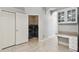 Laundry area with side-by-side washer and dryer, and built-in storage shelves for organization at 27810 Sky Lake Cir, Wesley Chapel, FL 33544