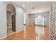 Open-concept living area with hardwood floors, stainless steel refrigerator, and natural light at 27810 Sky Lake Cir, Wesley Chapel, FL 33544
