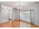 Living room with hardwood floors and natural lighting from a large window at 27810 Sky Lake Cir, Wesley Chapel, FL 33544