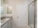 Bathroom features granite counters, a glass-enclosed shower, and neutral tones at 2919 Grand Kemerton Pl, Tampa, FL 33618