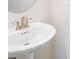 Close-up of a clean white pedestal sink in a bathroom at 2919 Grand Kemerton Pl, Tampa, FL 33618