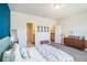 Spacious bedroom with a blue accent wall, and a large bed at 2919 Grand Kemerton Pl, Tampa, FL 33618