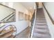 Inviting hallway with tile flooring and stairs leading to the upper level at 2919 Grand Kemerton Pl, Tampa, FL 33618