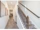 Inviting hallway with tile flooring and stairs leading to the upper level at 2919 Grand Kemerton Pl, Tampa, FL 33618