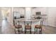 Modern kitchen featuring stainless steel appliances, granite countertops, and stylish bar stool seating at 2919 Grand Kemerton Pl, Tampa, FL 33618