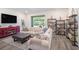 Comfortable living room featuring a neutral color palette, large windows, and shelving at 2919 Grand Kemerton Pl, Tampa, FL 33618